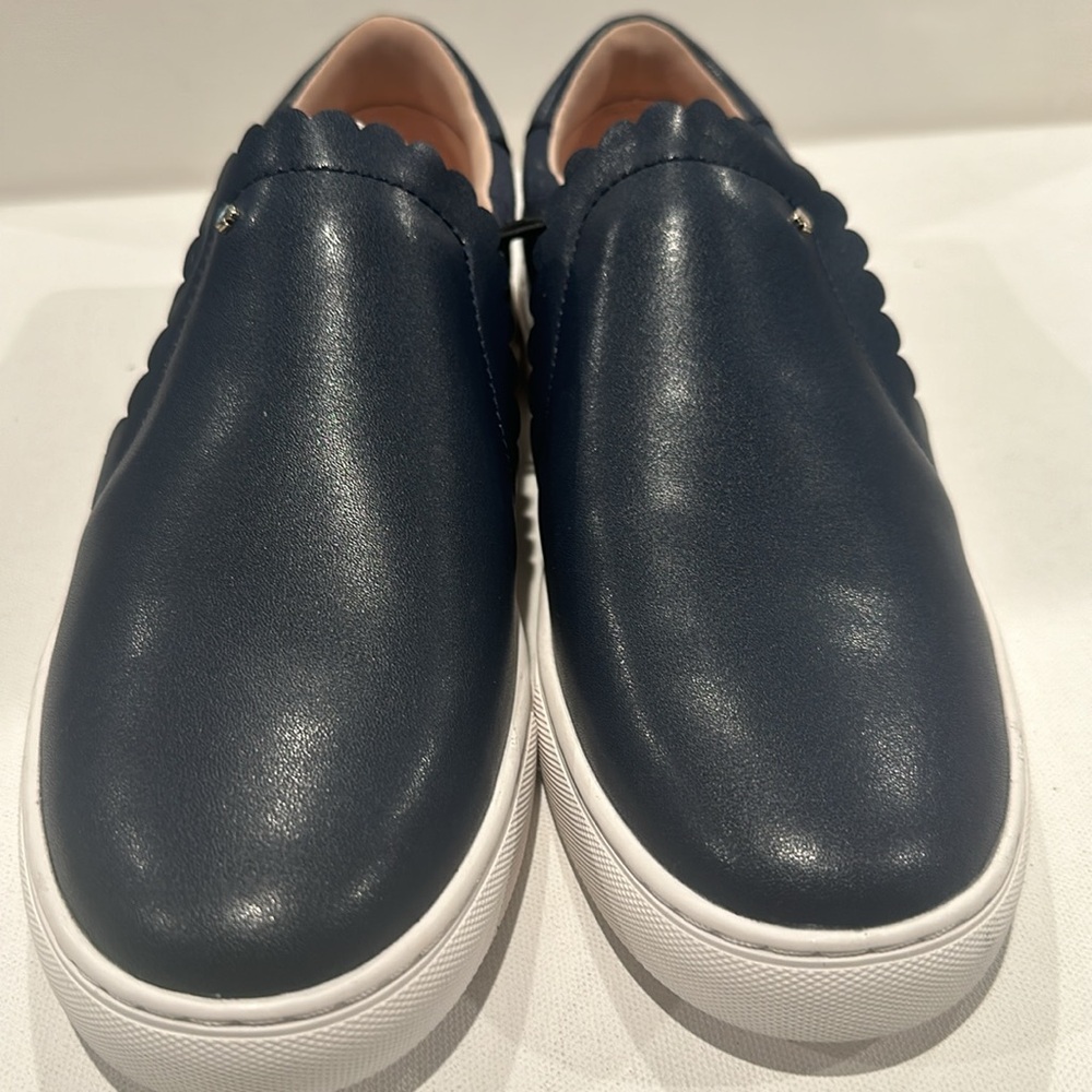 NWT Kate Spade Leather & Canvas Slip on Sneakers with Classic goldtone Heart.